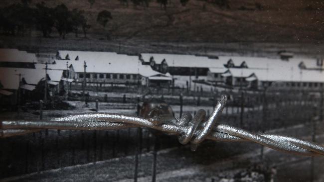 Photo of the Cowra POW camp with a piece of the barbed wire encircling it.