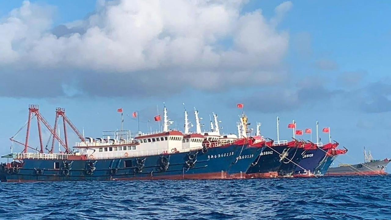 Chinese vessels anchored at Whitsun Reef, some 320 kilometres west of Palawan Island in the South China Sea. Picture: AFP