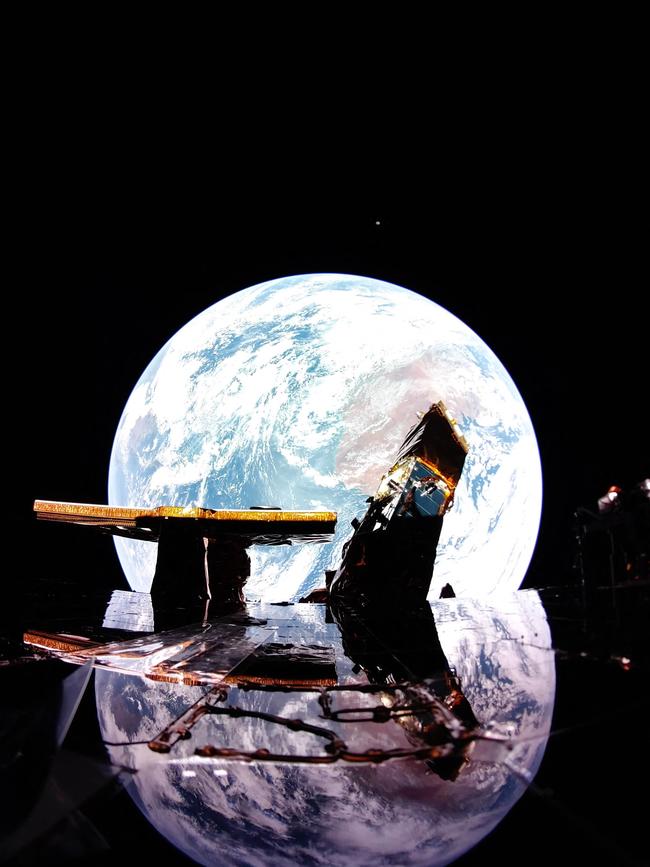 Earth reflects off Blue Ghost’s solar panel with the moon on the horizon. Picture: AFP.