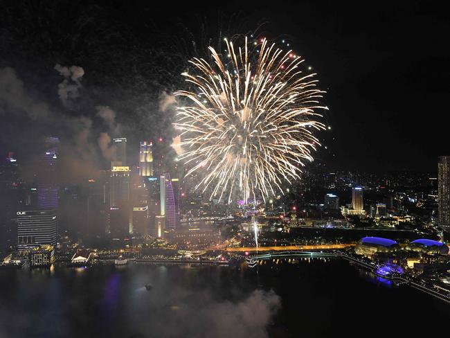 Fireworks burst over the water of Marina Bay during the eve of the New Year before the main countdown celebration in Singapore on December 31, 2018. Picture: AFP