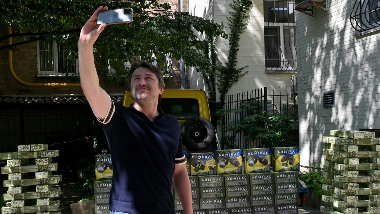 Serhiy Prytula, a former stand-up comedian whose crowdfunding for the Ukrainian military have made him a national hero, makes selfie in front of equipment for the army. Picture: AFP