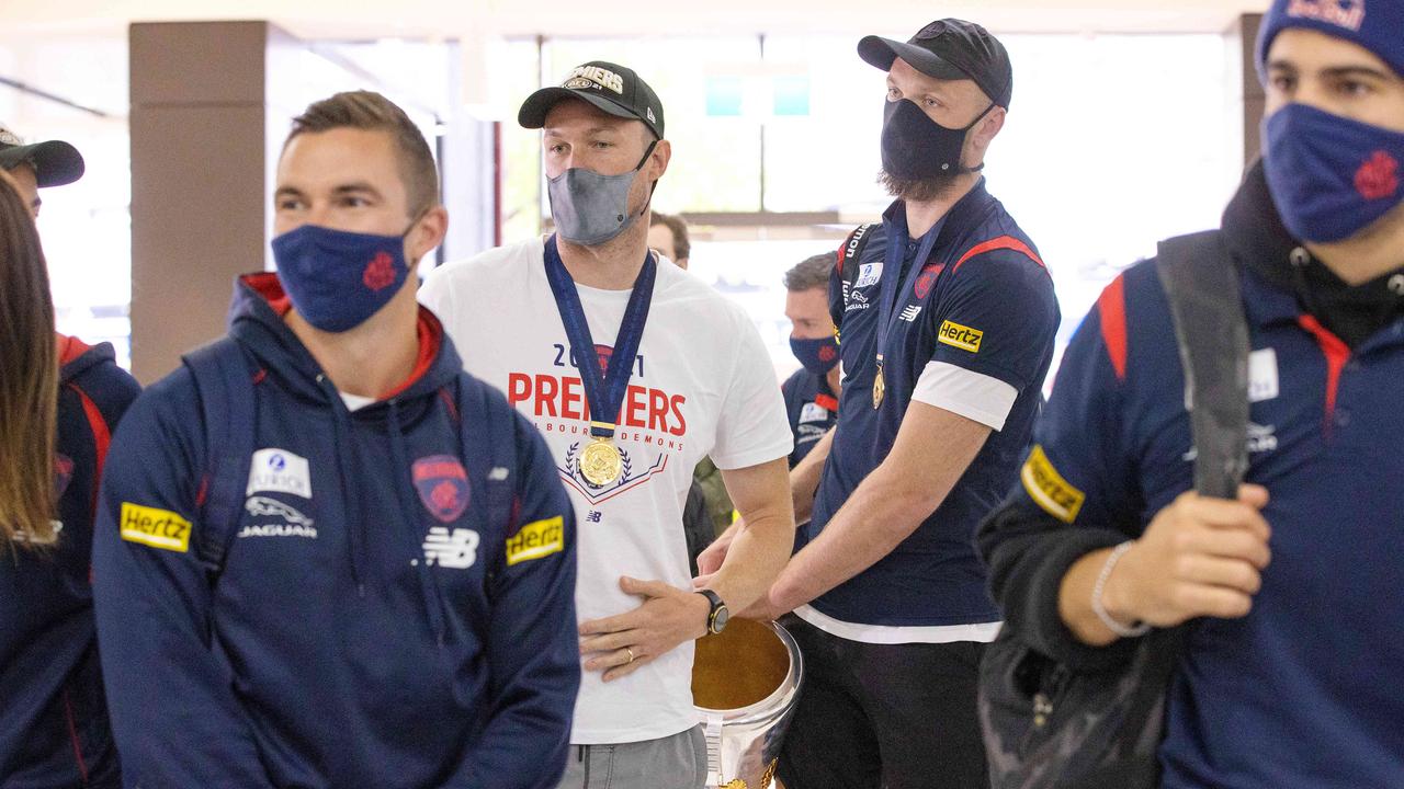 Melbourne players arrive home at Tullamarine Airport. Picture: Mark Stewart