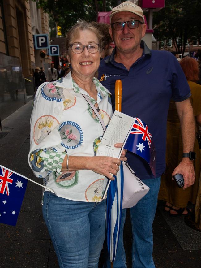 Thousands of people have braved the rain to gather in Brisbane for Anzac Day services. Picture: Grace Kessels