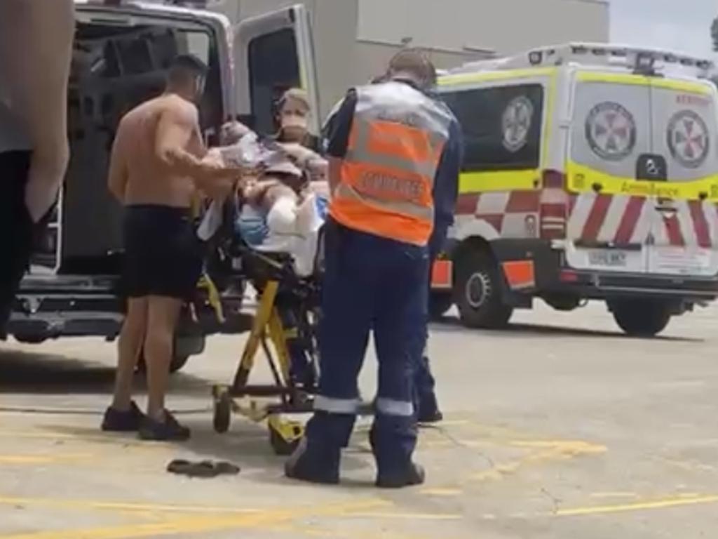 A man shot as he entered the World Gym in Prospect is taken away by NSW Ambulance paramedics. Picture Supplied,