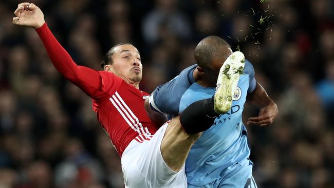 Zlatan Ibrahimovic of Manchester United (L) and Vincent Kompany of Manchester City (R).