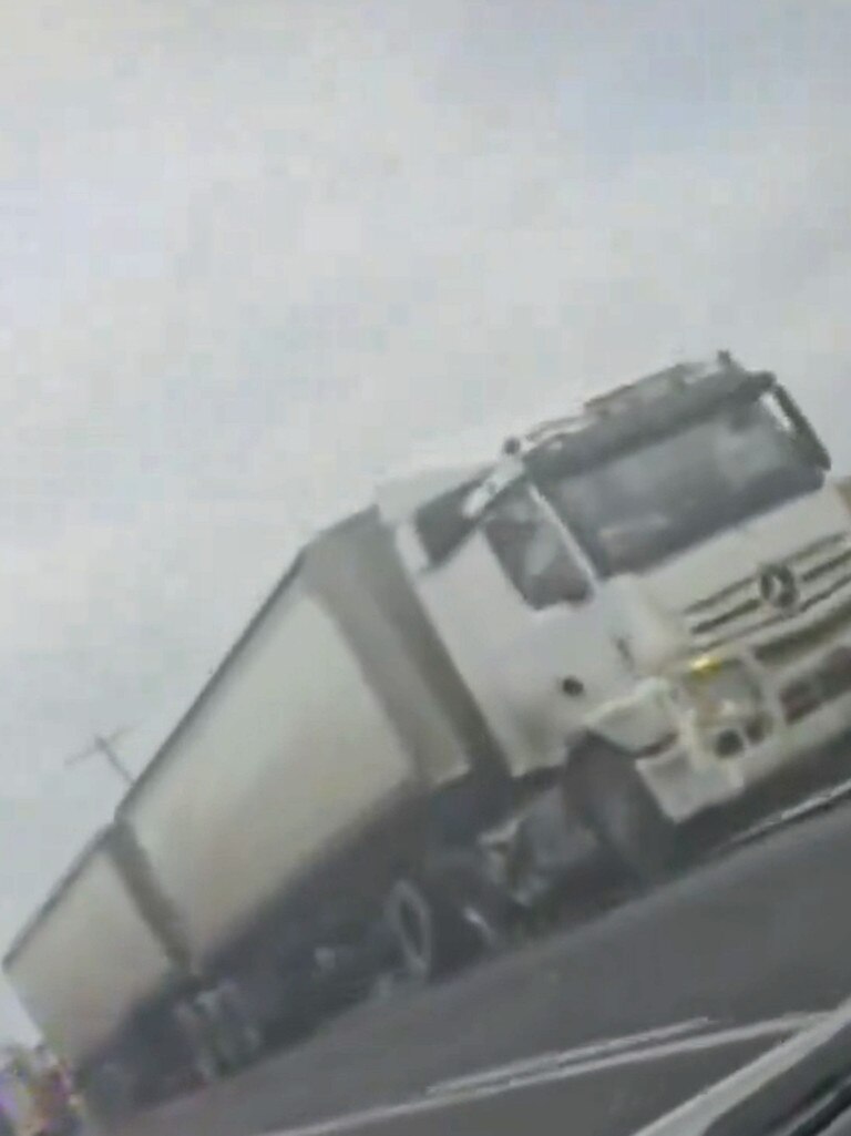 A woman has died after being stabbed at an Innisfail house. A short time later, a vehicle has crashed into this truck on the Bruce Highway at Sandy Pocket. Picture: 9News