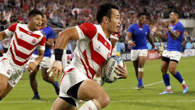 Japan's Kenki Fukuoka runs in to score against Samoa. Picture: AP