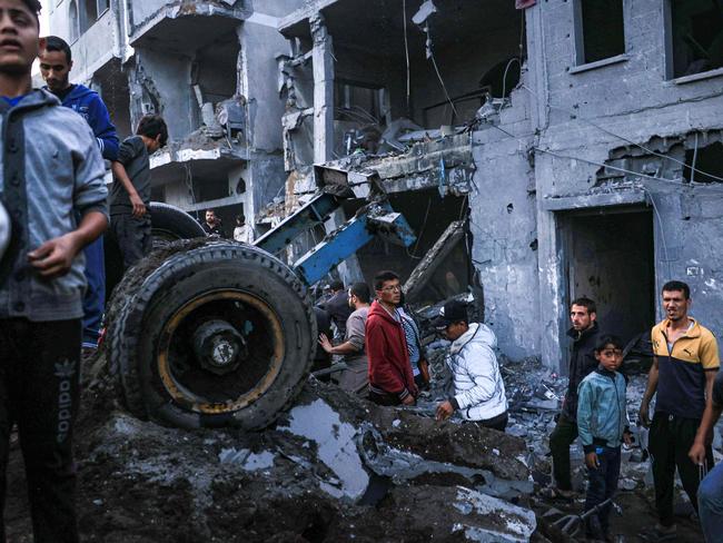 Palestinians check the damages after an Israeli strike in Rafah in the southern Gaza Strip. Picture: AFP