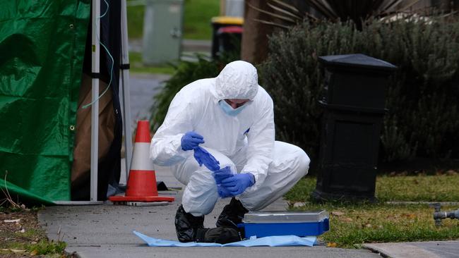 Forensic police at the crime scene. Picture: Luis Enrique Ascui