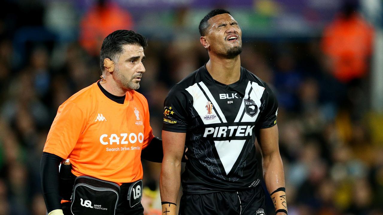 LEEDS, ENGLAND - NOVEMBER 11: Ronaldo Mulitalo of New Zealand receives medical attention during the Rugby League World Cup Semi-Final match between Australia and New Zealand at Elland Road on November 11, 2022 in Leeds, England. (Photo by Jan Kruger/Getty Images for RLWC)