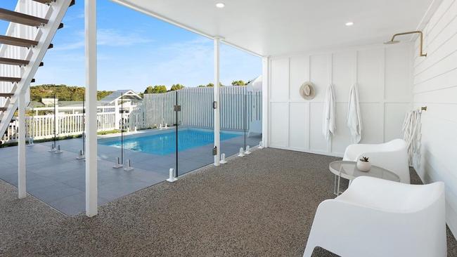 The property boasts an in-ground pool with adjoining outdoor shower and sitting area. Picture: Contributed