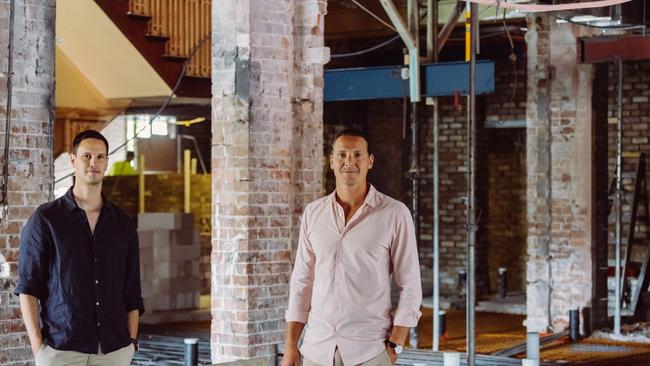 Owners of the newly renamed Harbord Hotel, Lachlan Cottee and Glenn Piper, in what was the main bar which has been gutted as part of a $3m renovation. Picture: Supplied.