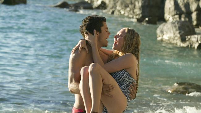 Actor Dominic Cooper and actress Amanda Seyfried in scene from film 'Mamma Mia!'.