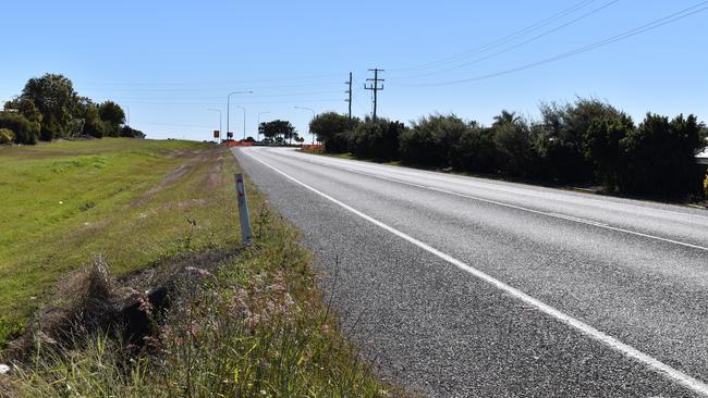 Eimeo Road in Rural View the day after a passing car struck and killed a woman, 33. The woman's four children in a Commodore parked on the side of the road witnessed the incident.