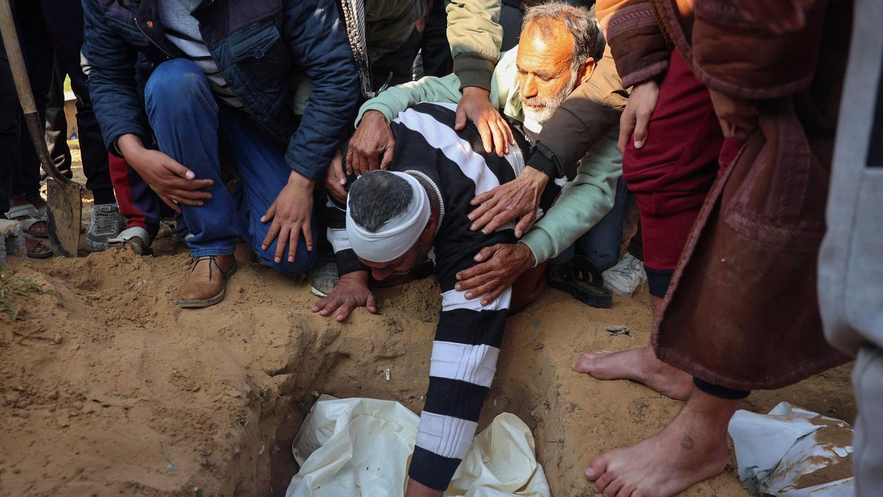 Palestinians mourn their dead. Picture: AFP