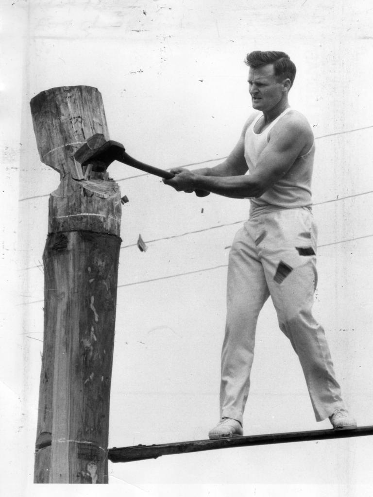 Royal Adelaide Show 1969. Tasmanian axeman B. J. Youd makes the final stroke to win the third heat in the tree-felling contest. His time waa 2: 14 seconds. The event was won by P. E. Hillcoat, Queensland.