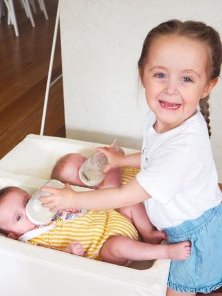 Charlotte with her little, twin sisters who don’t suffer from eczema.