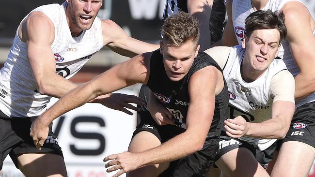 Port Adelaide Training at Alberton Oval. Dan Houston gets tackled by Zak Butters with Brad Ebert, Peter Ladhams and Wylie Buzza in the background. Picture SARAH REED