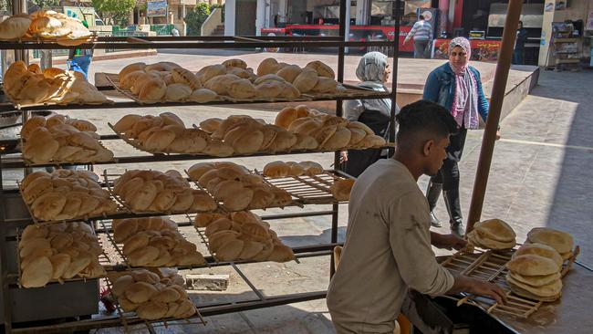 Egyptian men work in a bakery at a market in Cairo.