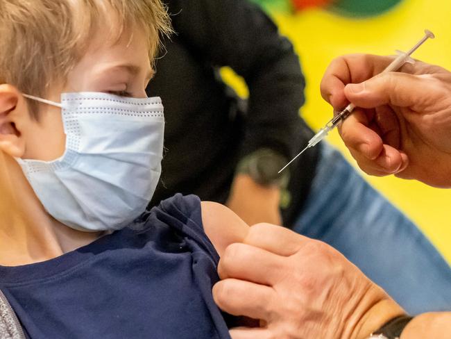 A doctor inoculates a 5-year-old with the Pfizer vaccine in Germany. Picture: AFP