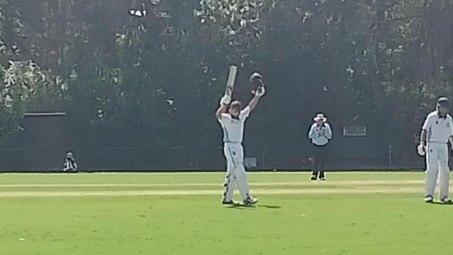 Jethro Cox raises his bat after scoring his century. Picture: Facebook