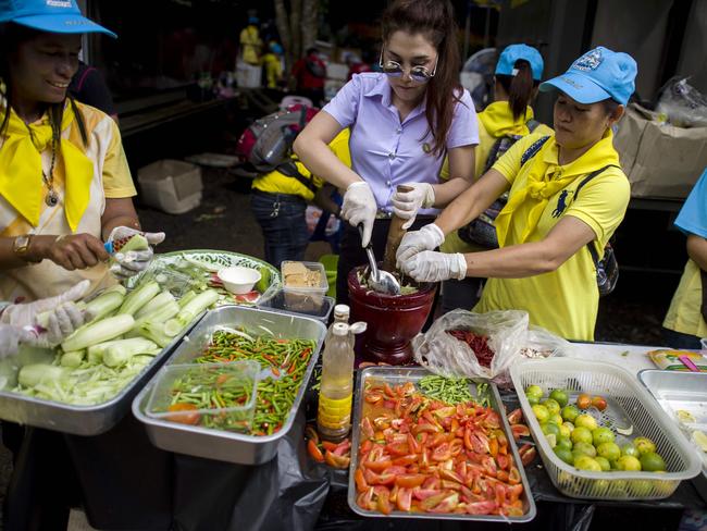 Thai volunteers cook for hundreds of local and foreign rescue personnel at the Tham Luang cave area. Picture: AFP