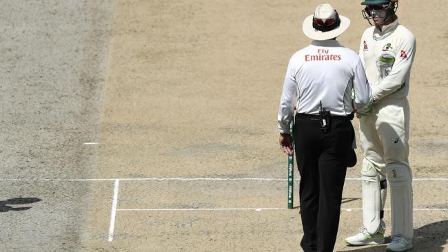 Tim Paine has a word with umpire Richard Illingworth.