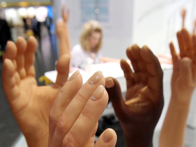 Hand prostheses are displayed during the International Trade Show for Prosthetics, Orthotics and Orthopaedic footwear technology "Orthopaedie und Reha-Technik 2010" in Leipzig, eastern Germany on May 12, 2010. The trade fair takes place from May 12 to May 15, 2010 and presents the latest innovations in orthopaedics. AFP PHOTO DDP/ SEBASTIAN WILLNOW GERMANY OUT