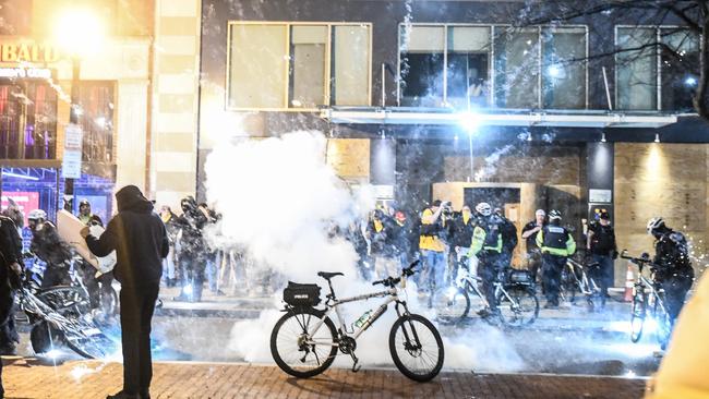 An explosion goes off in front of a Washington hotel where the Proud Boys were staying last month. Picture: AFP