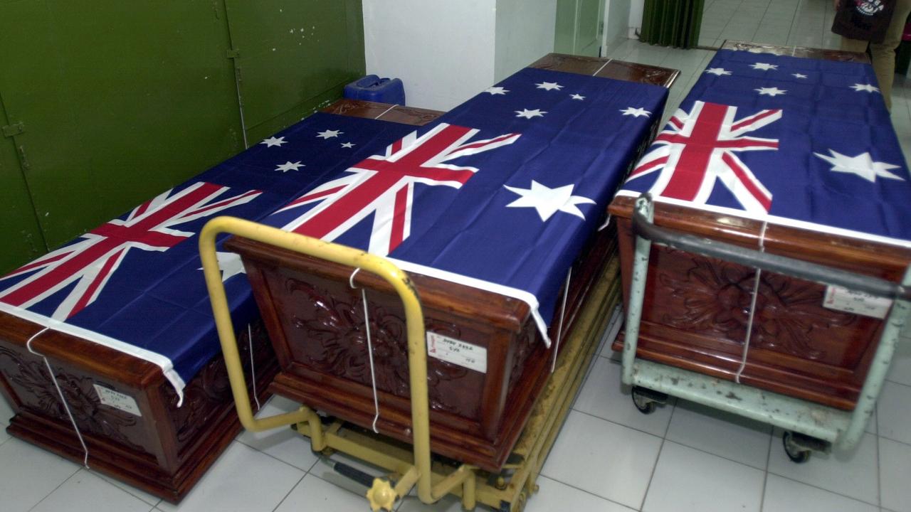 Three coffins of Australian victims line up at Sanglah hospital, Denpasar, Bali, Indonesia, Saturday, Oct. 08, 2005. Three of Australian victims Collin Zwolianski, Fiola Zwolinski and Jennifer Williamson, who were killed during the suicide bombers attacked of three restaurants on the resort island, were to return back to Australia. (AP Photo/Firdia Lisnawati)