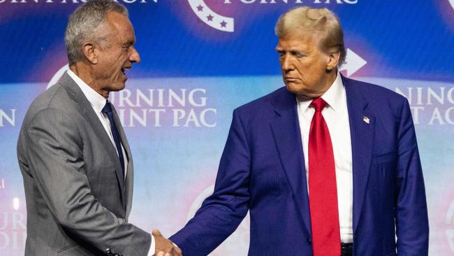 Donald Trump shakes hands with Robert F. Kennedy Jr. at a campaign rally in Georgia. Picture: AFP.