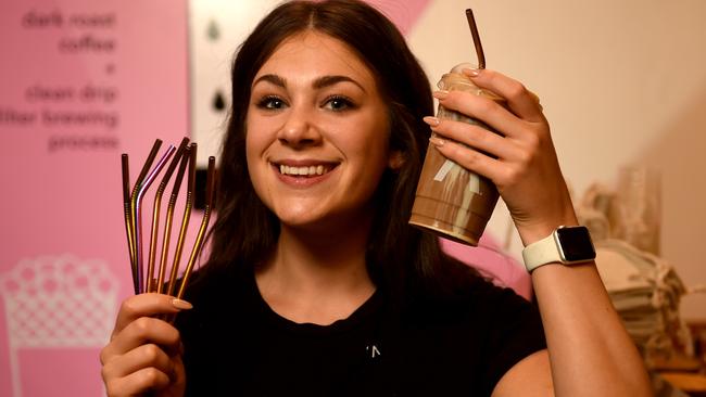 Katie Robinette at Caphe Sua Da with metal straws and cups made from plants. Picture: Evan Morgan