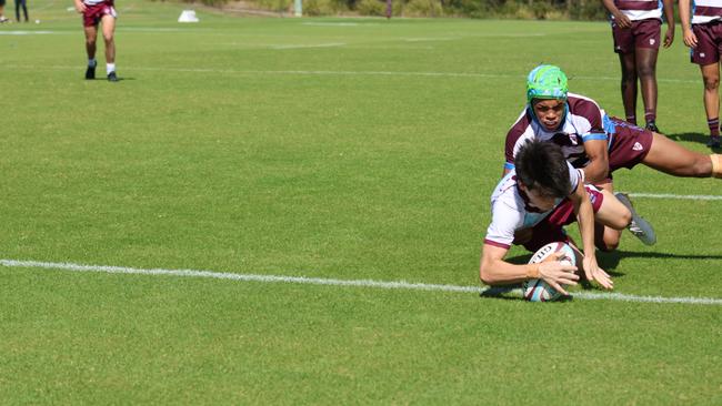 DJ Gray trying to save a try from Lucas Wood. Picture credit: Barbara Herrmannsen