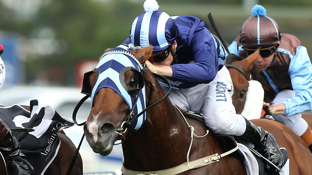 SYDNEY, AUSTRALIA - FEBRUARY 21: Hugh Bowman ( Red Cap ) rides Hallowed Crown to win race 6, The Blackwoods CRC Hobartville Stakes during Sydney racing at Rosehill Gardens on February 21, 2015 in Sydney, Australia. (Photo by Anthony Johnson/Getty Images)