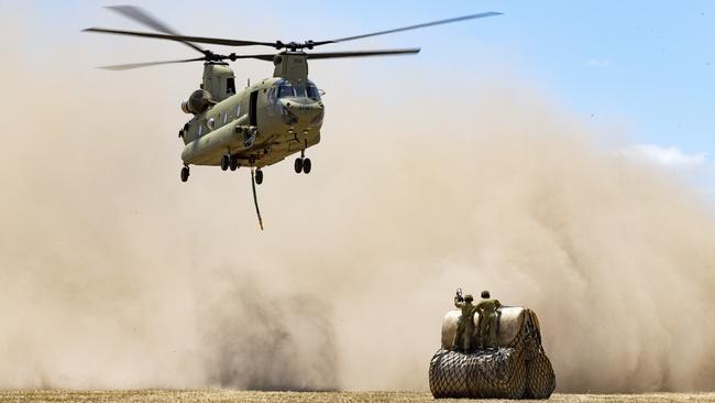 CH-47 Chinooks load hay bales to deliver to remote bushfire-affected farms. Picture: ADF