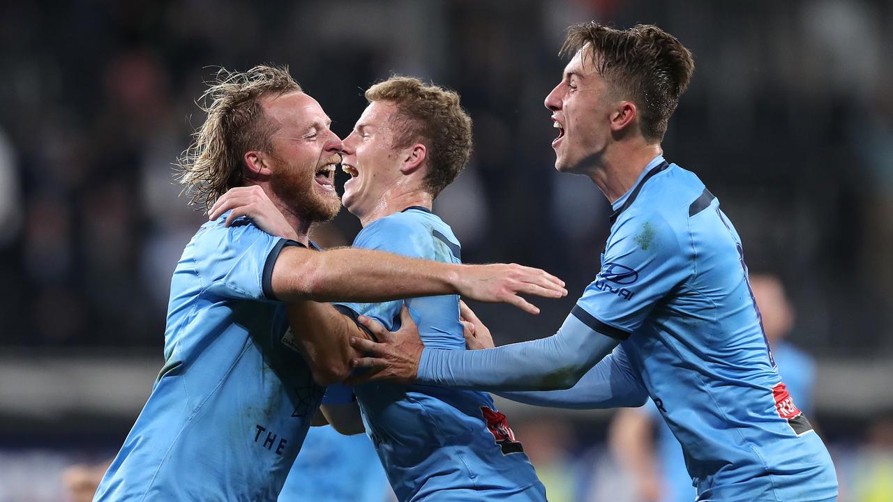 Rhyan Grant is congratulated by Sydney FC teammates after scoring in the A-League grand final. Picture: Matt King/Getty Images