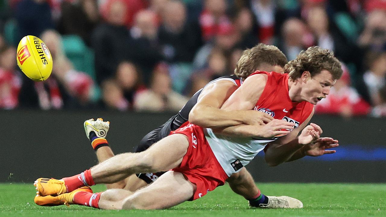 Nick Blakey is tackled by Dan Butler. Picture: Mark Metcalfe / AFL Photos / via Getty Images