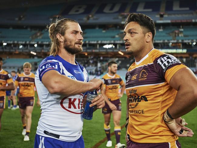 Kieran Foran of the Bulldogs and Alexander Glenn of the Broncos post match during the round 25 NRL match between the Canterbury Bulldogs and the Brisbane Broncos. Picture: AAP