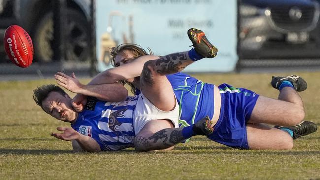 Outer East: Officer’s Kyle Hagger is caught by Berwick’s Kai Maas. Picture Valeriu Campan