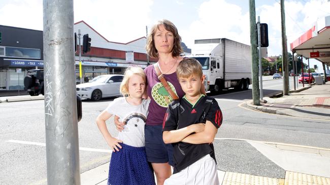 Ili Bone with her children Evie Leonard 8 and Jo Leonard 9 at Moorooka. She is concerned about traffic safety on Ipswich Rd at Annerley where there have been 94 crashes since 2015. Picture: AAP/Ric Frearson