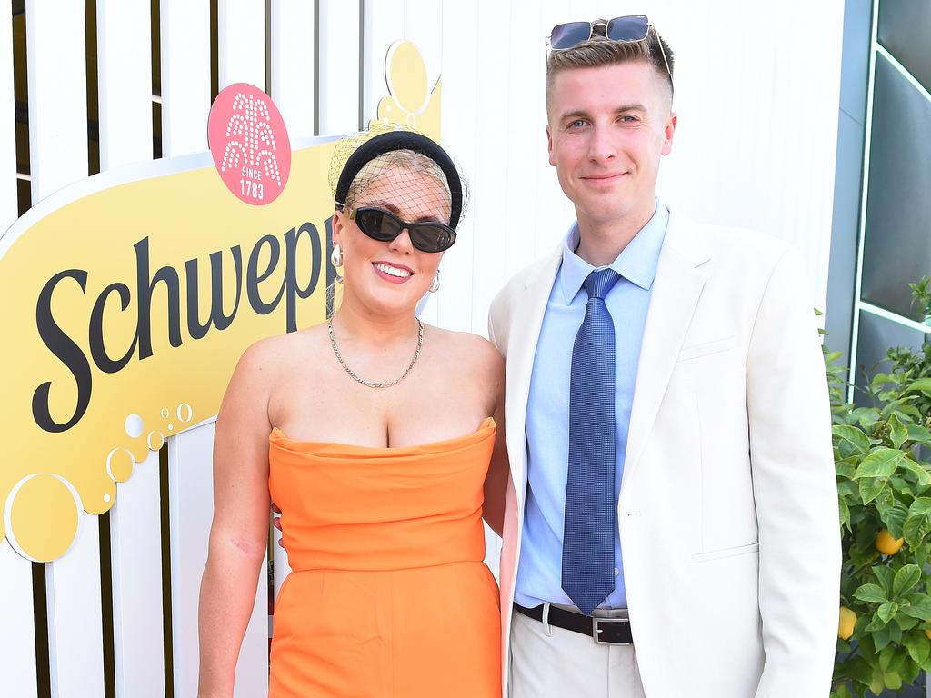 Brooke Warne and partner Alex Heath enjoyed the sunshine at the Schwepps marquee after a difficult time getting to the racetrack. Picture: NCA NewsWire / Josie Hayden