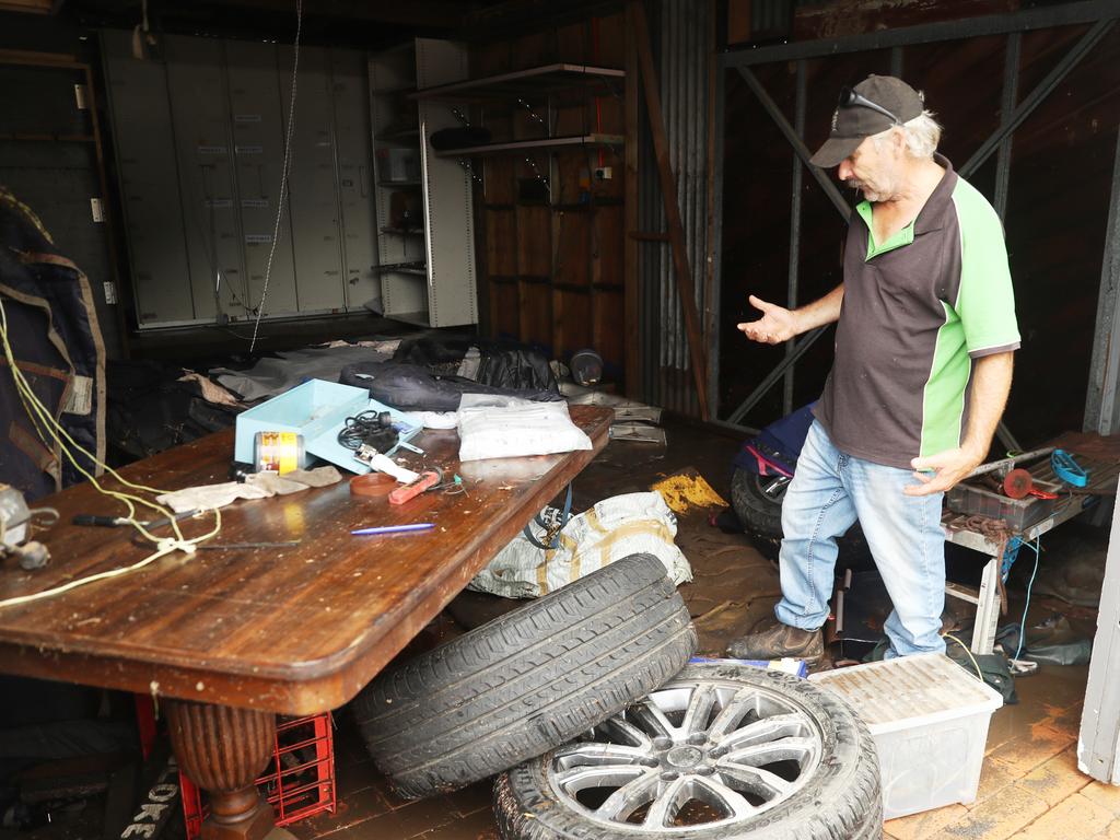 Camden a day after another flood in the area in two weeks .Phil Oliver ( cap) sevens damage on his property at 2 Exeter st Camden.