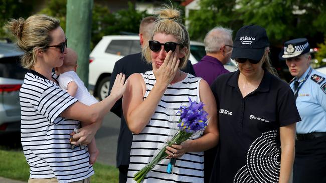 Mourners at the scene where Hannah Clarke and her children were killed by their father Rowan. Picture AAP/David Clark.