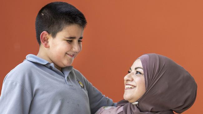 Shafica Berjaoui with Son Ayoub, 8, who was identified as being at risk of autism when he was 12 months old. Picture: Aaron Francis