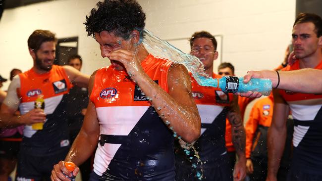 Nick Shipley is showered as GWS celebrates the win over Brisbane.