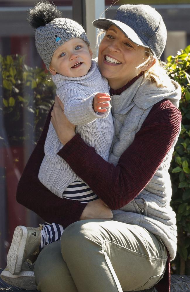 Carrie Bickmore plays with baby Evie while out celebrating her son’s birthday this year.