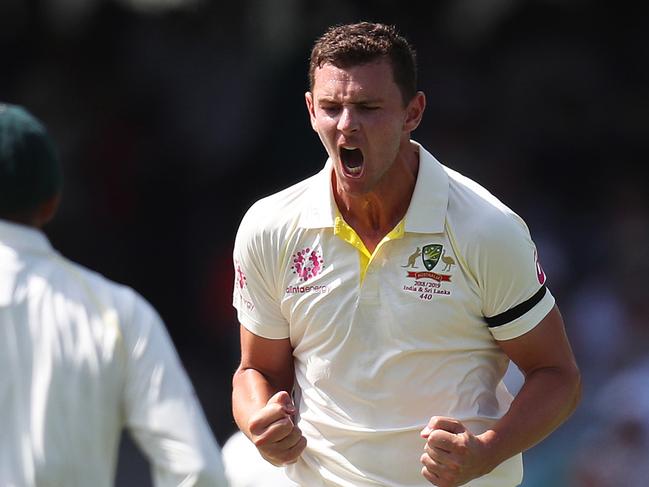 Australia's Josh Hazlewood celebrates the wicket of India's Virat Kohli caught behind during Day 1 of the 4th Test match between Australia and India at the SCG. Picture: Brett Costello