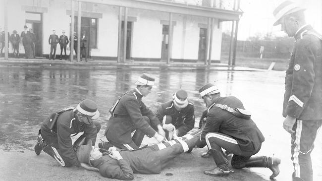 Police officers demonstrate first aid at the Thebarton barracks in 1921. Picture: State Library [PRG 280/1/23/10