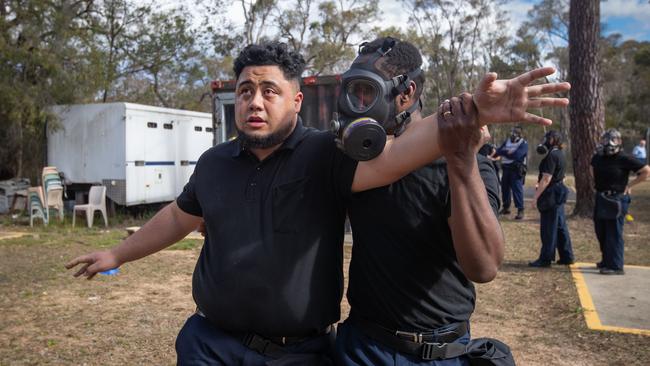 A trainee exits the CS gas chamber at Francis Greenway Correctional Complex. Picture: Julian Andrews