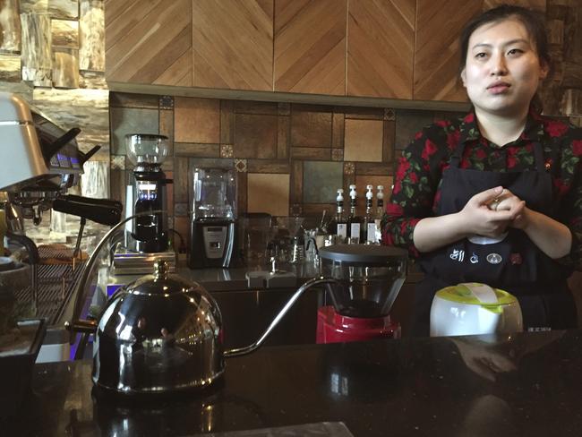 Barista Ri Hyon does not think much of Starbucks coffee, but is impressed by the chain’s popularity. Picture: AP Photo/Eric Talmadge